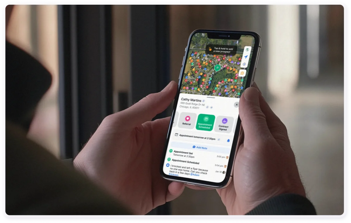 A contractor holding the Lead Scout app